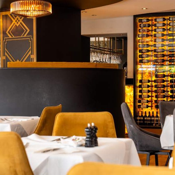 The bar and lit wine wall