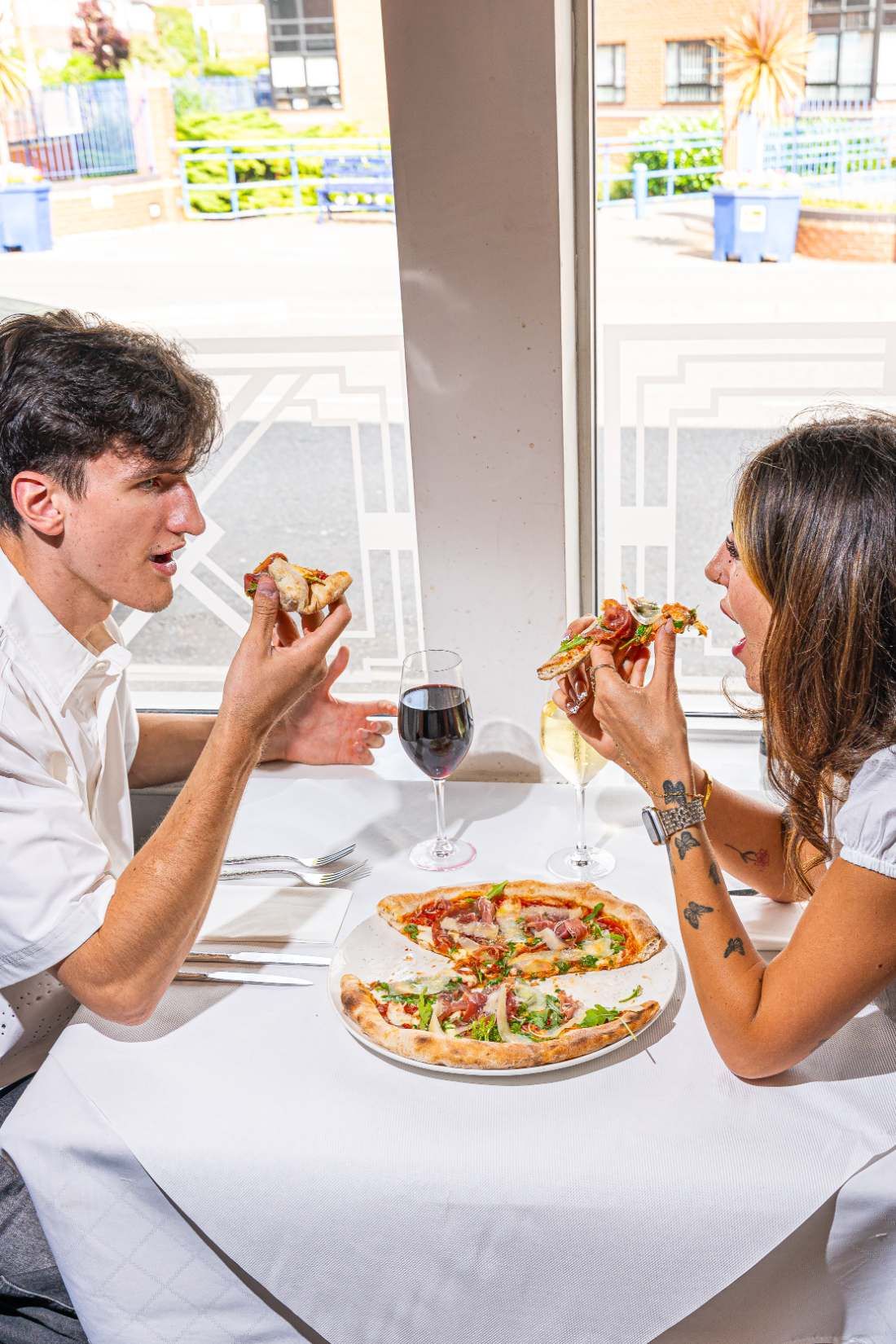 Guests sharing pizza